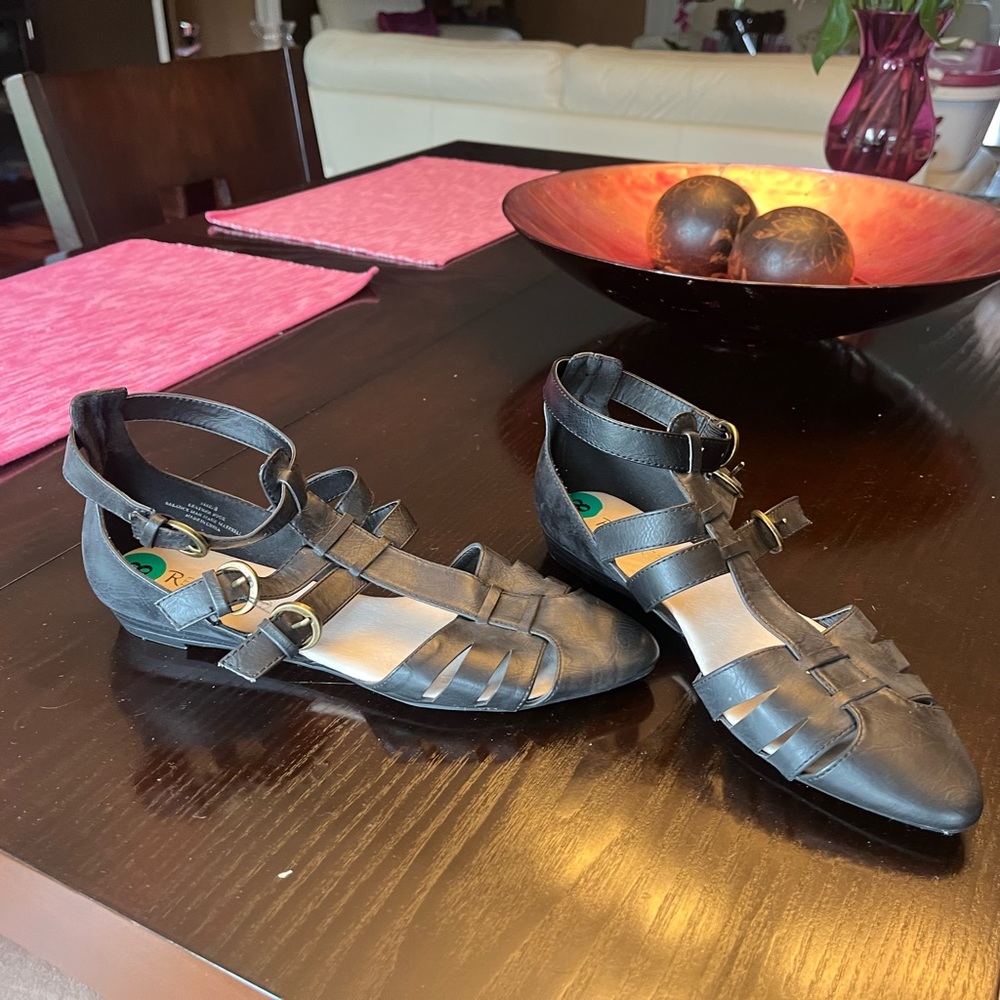 Faded, black leather sandal flats with gold buckles. Great condition!